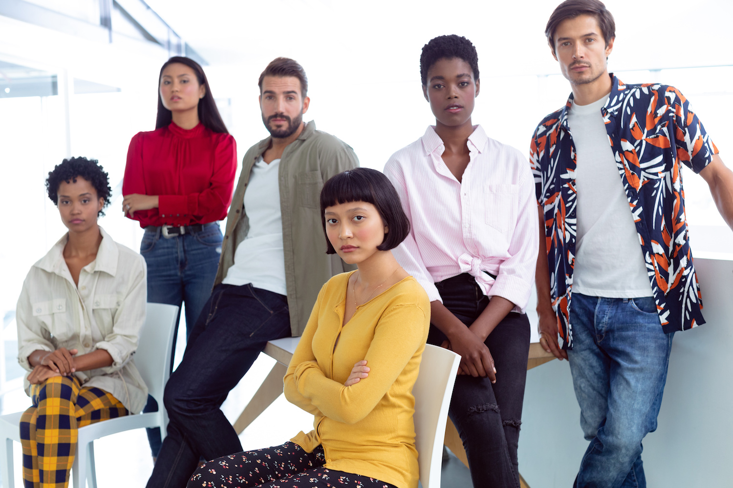 Business people looking at camera in a modern office