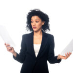 Front view of surprised african american businesswoman with pape